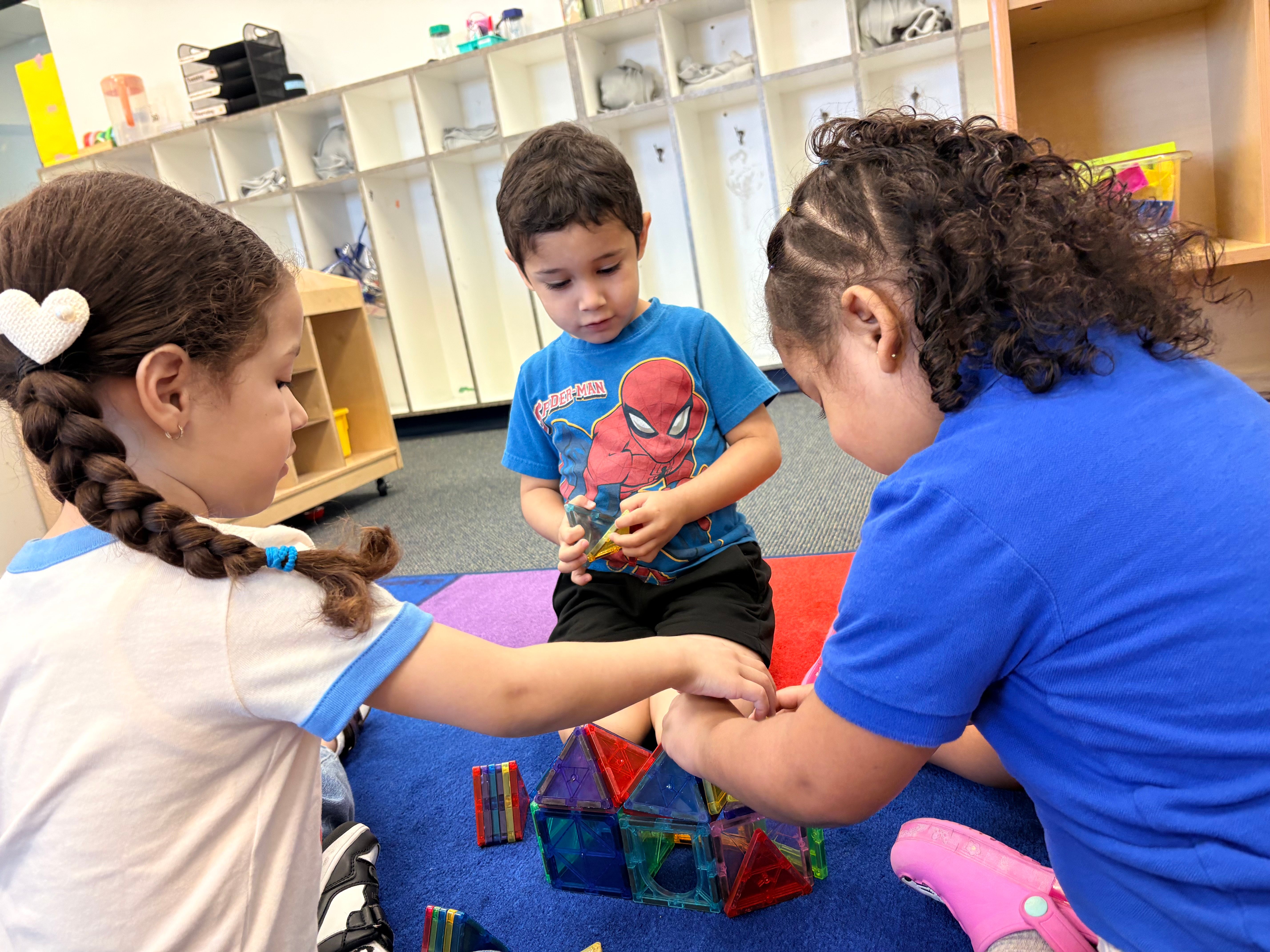 Kids learning and playing together in a cheerful classroom